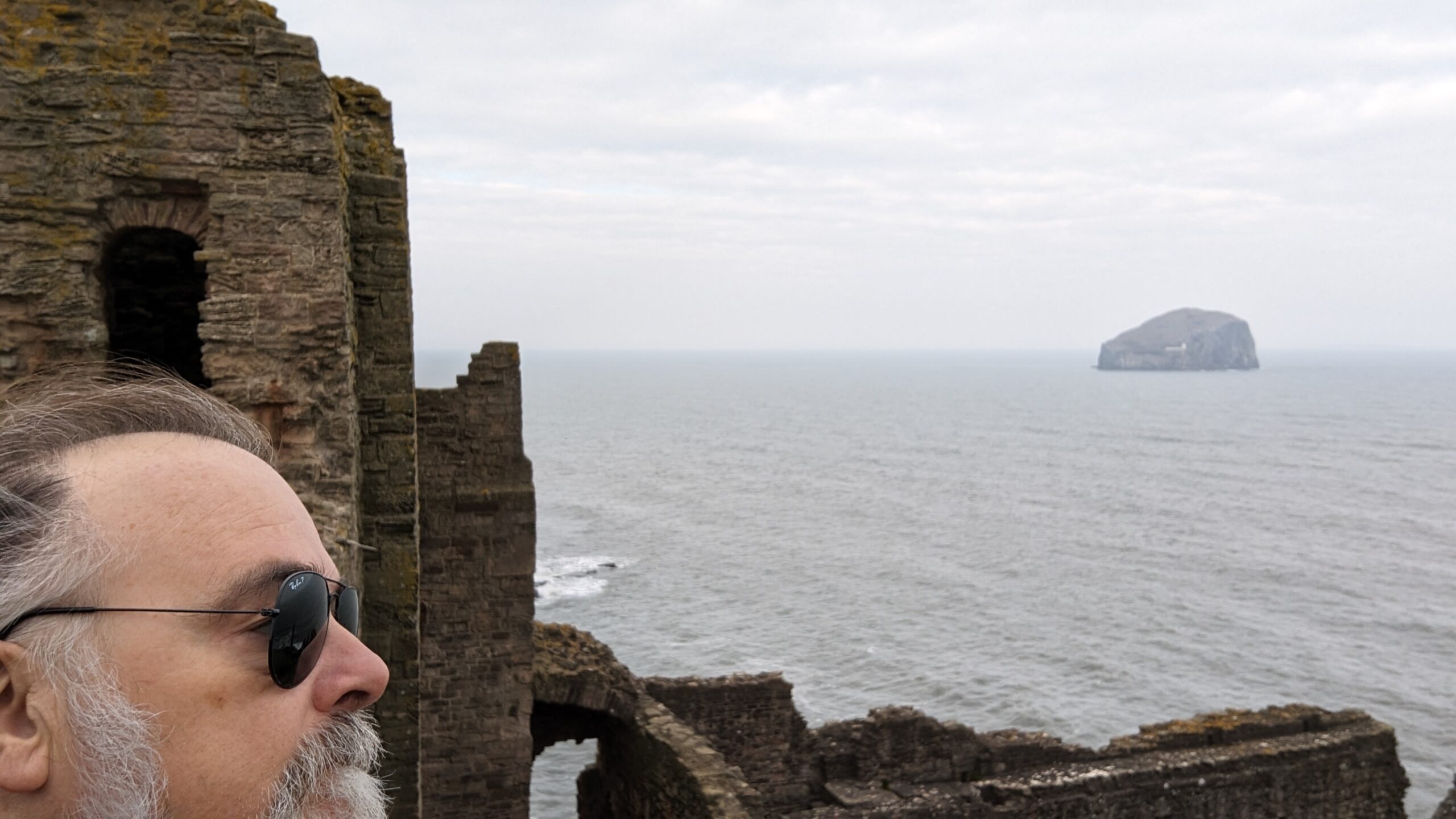Simon, the IT GP, in a mediaeval castle on the coast of Scotland